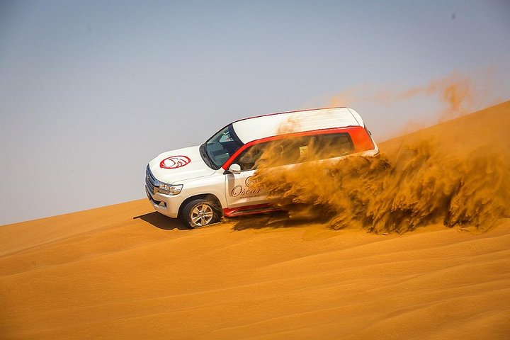 Experience the magic of Dubai's desert as you ride across golden dunes feeling the rush of adventure while taking in the stunning sunrise and pure tranquility of nature.